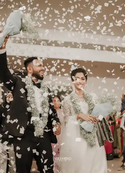 Newlyweds celebrating under a shower of confetti