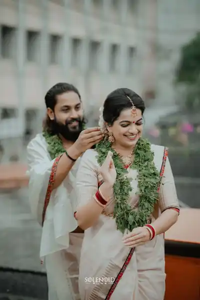 Couple exchanging garlands during a wedding ceremony